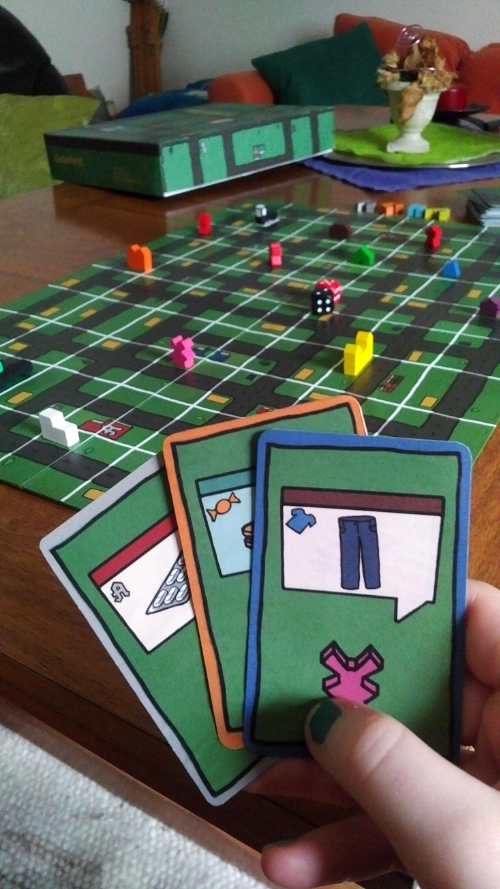 the cards in the game and the board in the background